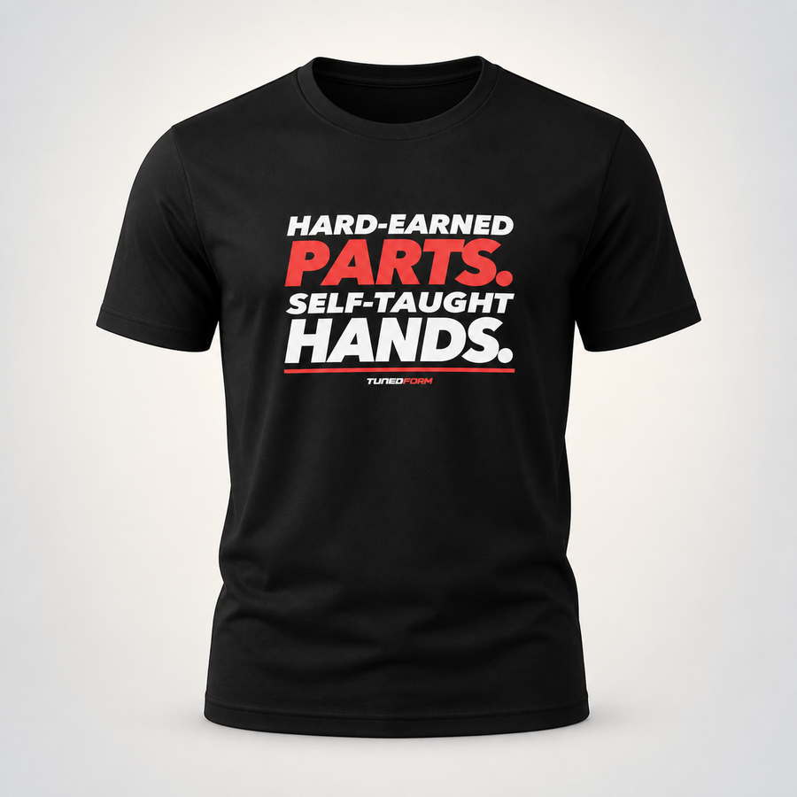 Hard-Earned Parts. Self-Taught Hands. Men's 100% Cotton T-Shirt on the TunedForm studio gradient